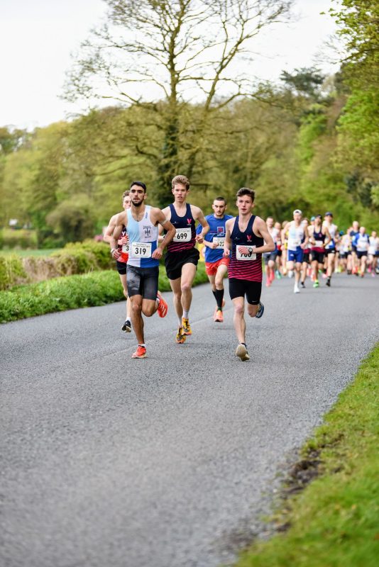 A Vale of York runner in the pack at a York and District Road Race League 10k at Tadcaster